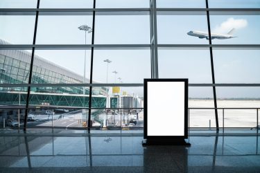 blank advertising light box on modern airport terminal